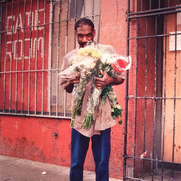 DAVE SCHUBERT - Man with flowers 6th St. 2002